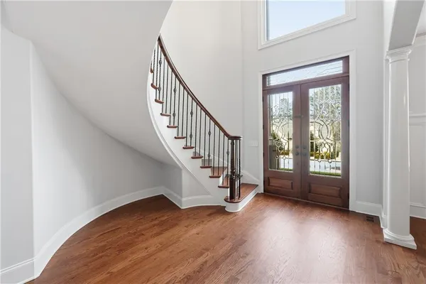 a view of a dining room with furniture window and wooden floor