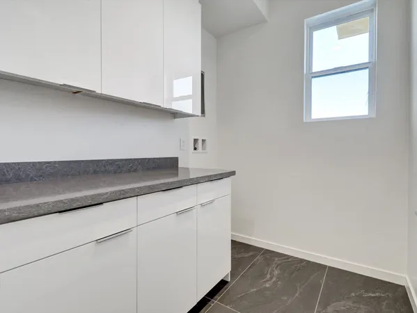 a kitchen with a stove and cabinets