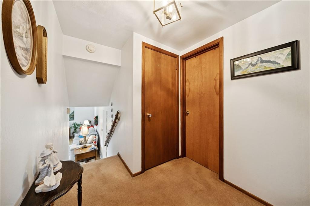 140 Possum Hollow Road Greensburg, PA 15601 - Photo 12 of 40 a view of a hallway with paintings on the wall