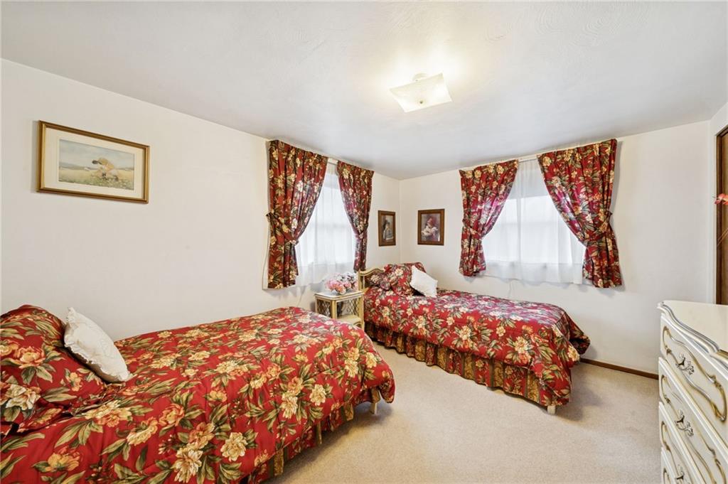 140 Possum Hollow Road Greensburg, PA 15601 - Photo 15 of 40 a bedroom with two beds and a painting on the wall