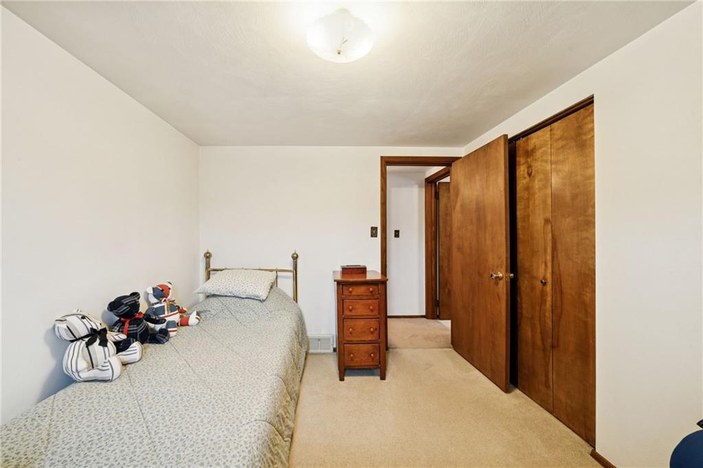 140 Possum Hollow Road Greensburg, PA 15601 - Photo 19 of 40 a bedroom with a bed and a table