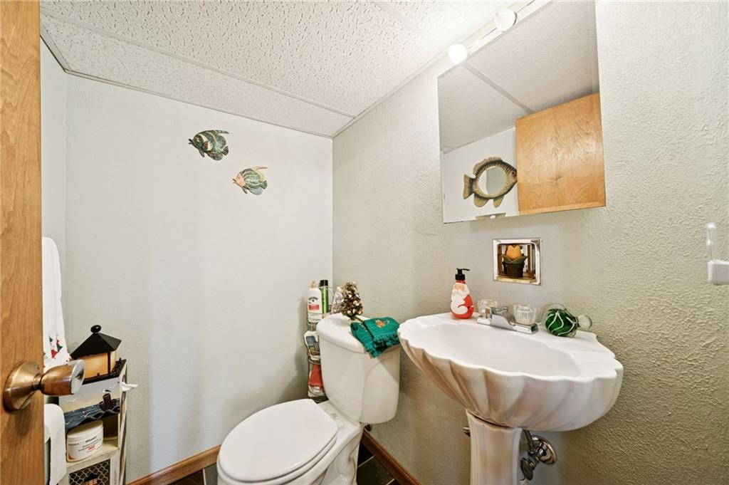 140 Possum Hollow Road Greensburg, PA 15601 - Photo 20 of 40 a bathroom with a sink mirror and toilet