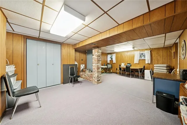 a view of a livingroom with furniture and a window