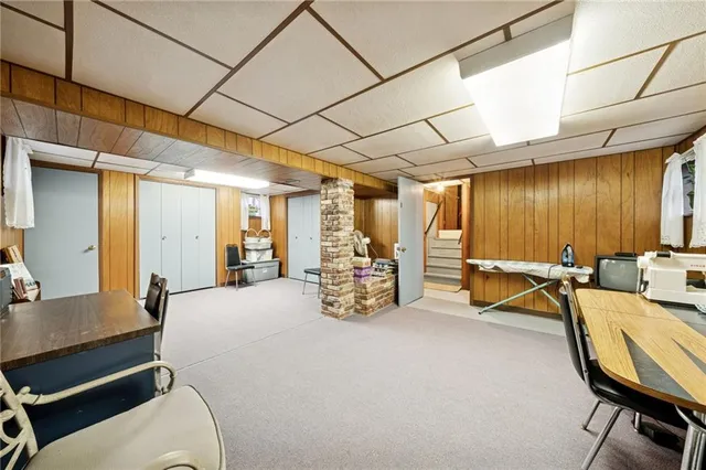 a bed room with a bed and a chair