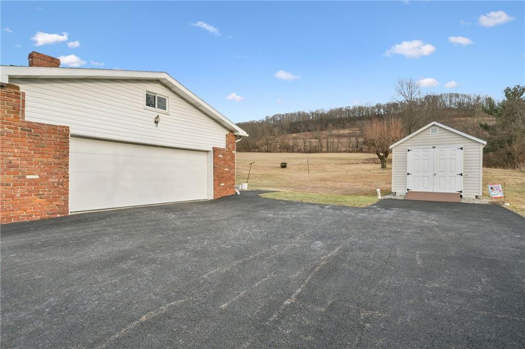 140 Possum Hollow Road Greensburg, PA 15601 - Photo 29 of 40 a view of garage and yard