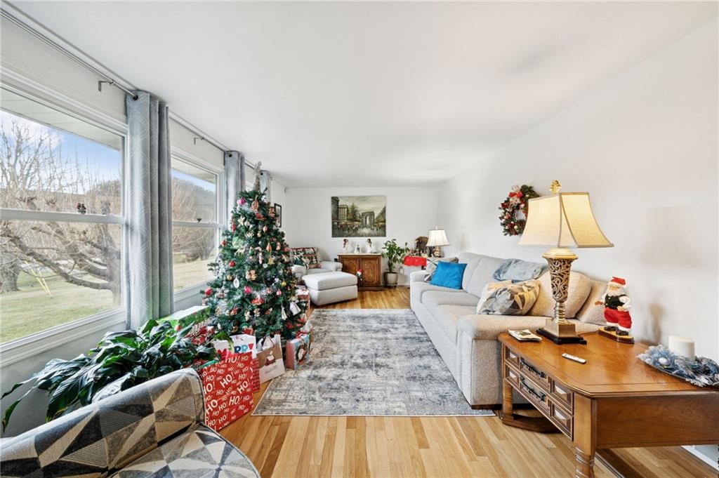 140 Possum Hollow Road Greensburg, PA 15601 - Photo 7 of 40 a living room with furniture and flowers