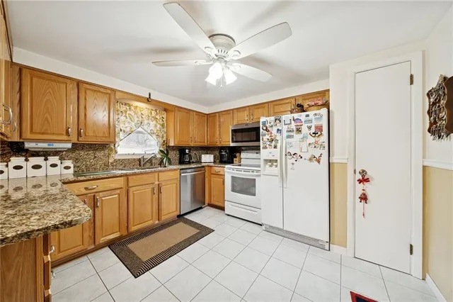 a kitchen with cabinets and window