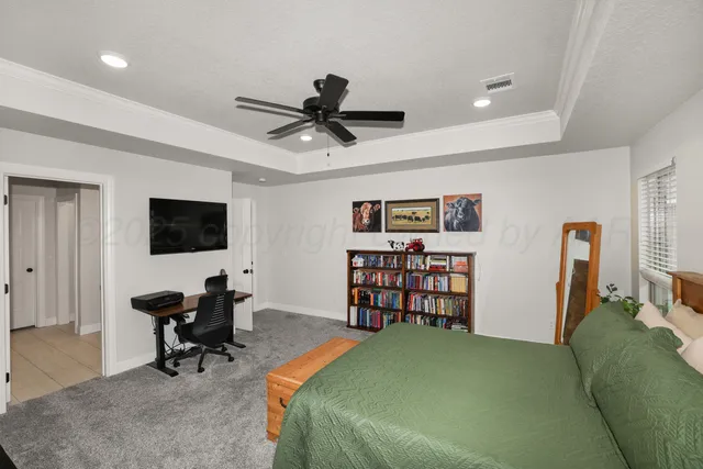 a bedroom with a workspace