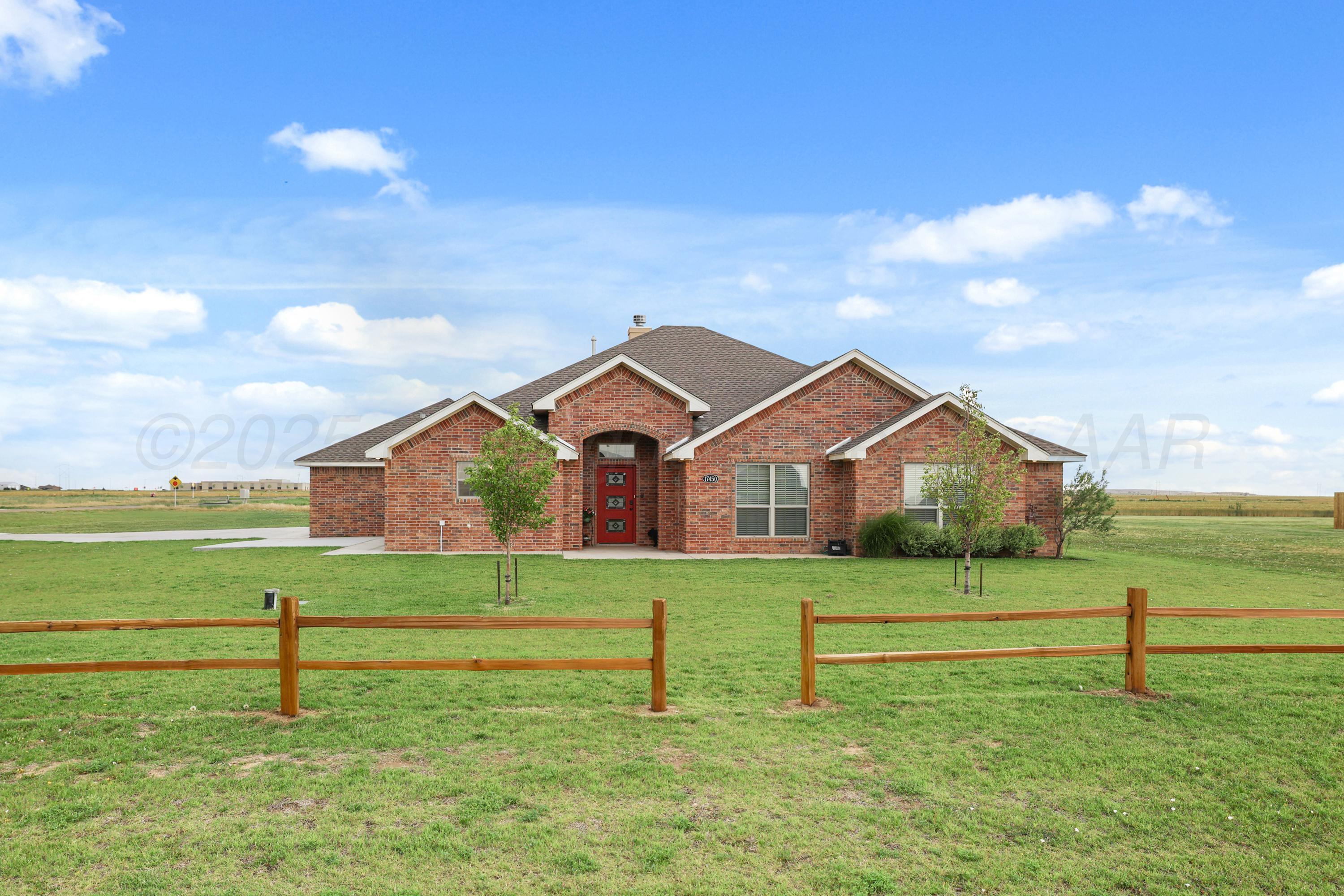 17450 Stone Creek Road Amarillo, TX 79124 - Photo 2 of 30 a front view of a house with a big yard