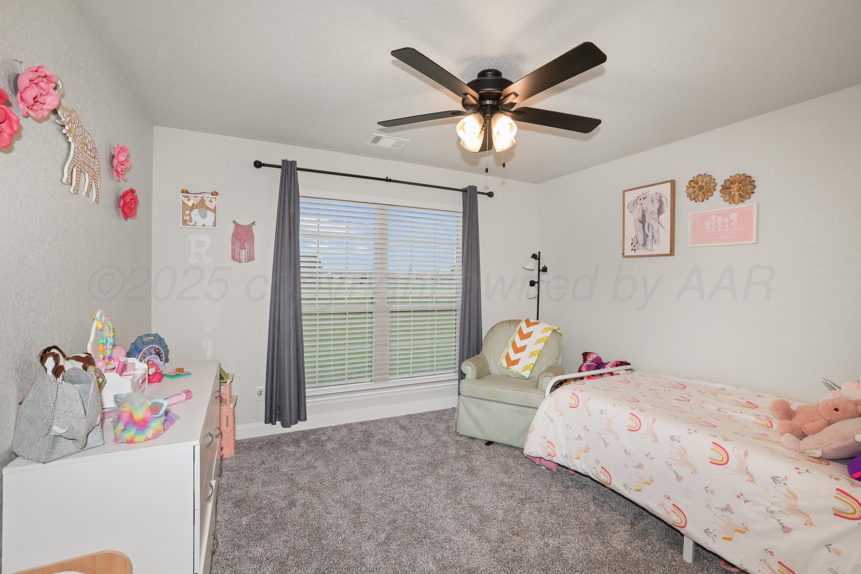 17450 Stone Creek Road Amarillo, TX 79124 - Photo 23 of 30 a bedroom with a bed and a window