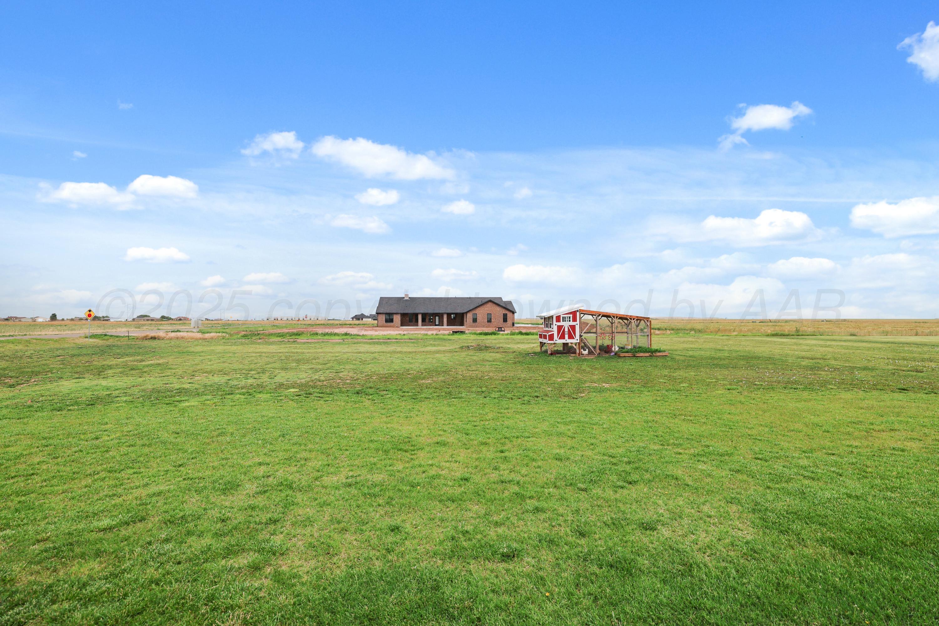 17450 Stone Creek Road Amarillo, TX 79124 - Photo 29 of 30 a green field with lots of tress in it