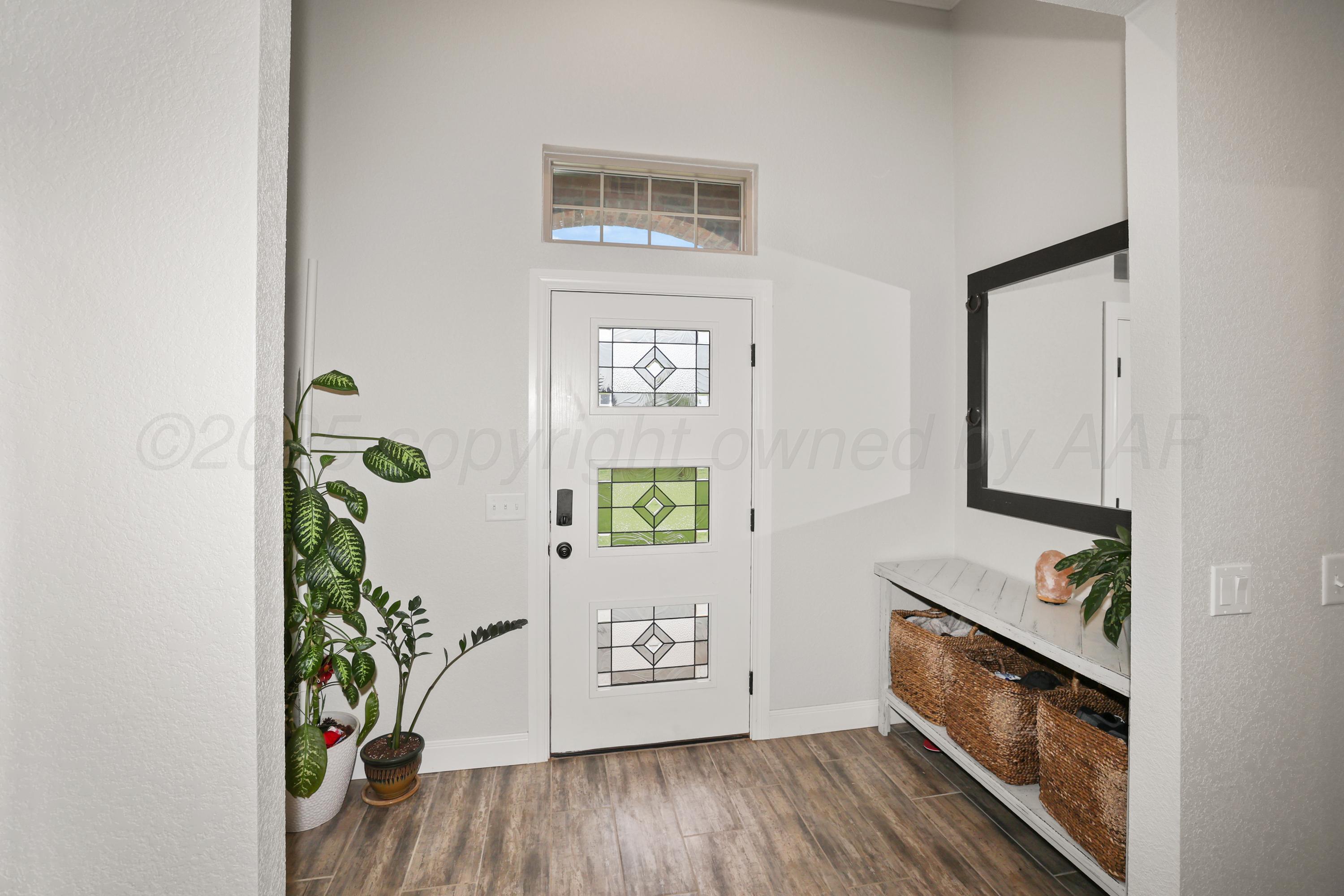 17450 Stone Creek Road Amarillo, TX 79124 - Photo 5 of 30 a view of an entryway with wooden floor