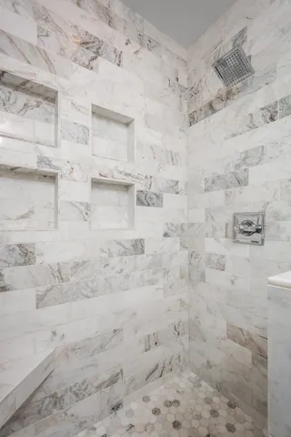 a view of a livingroom with furniture wooden floor and windows