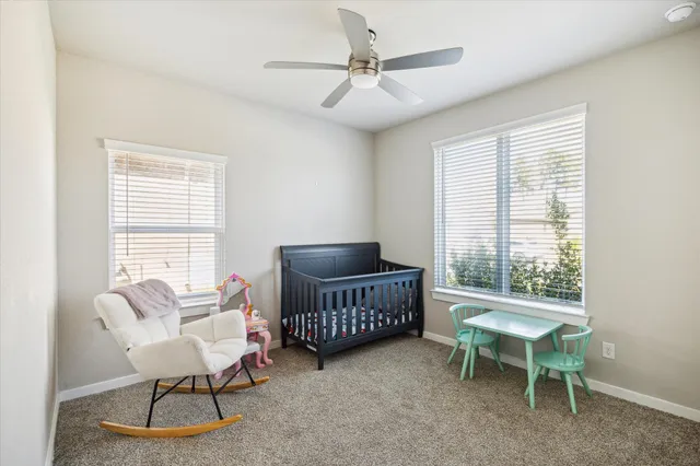 a view of a dining room with furniture and window