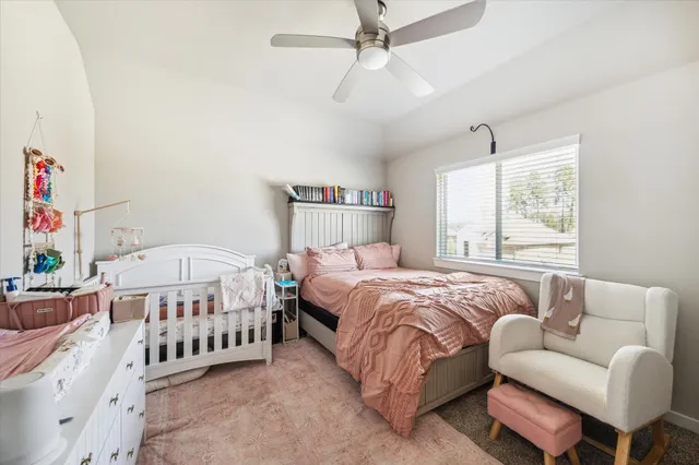 a living room with furniture a rug and a window