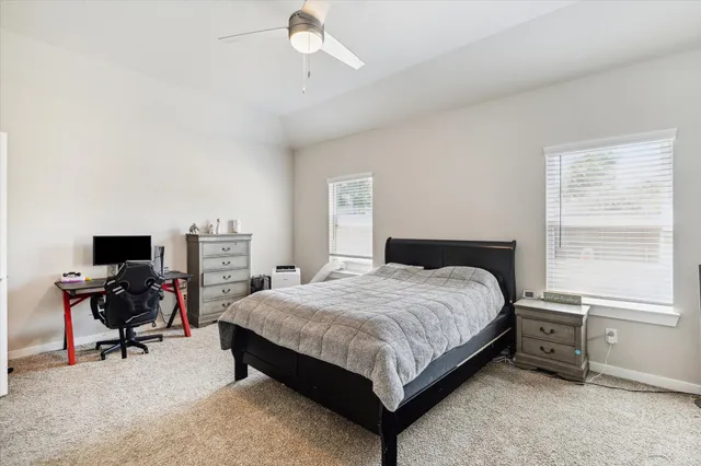 a kitchen with stainless steel appliances granite countertop a table chairs sink refrigerator and cabinets