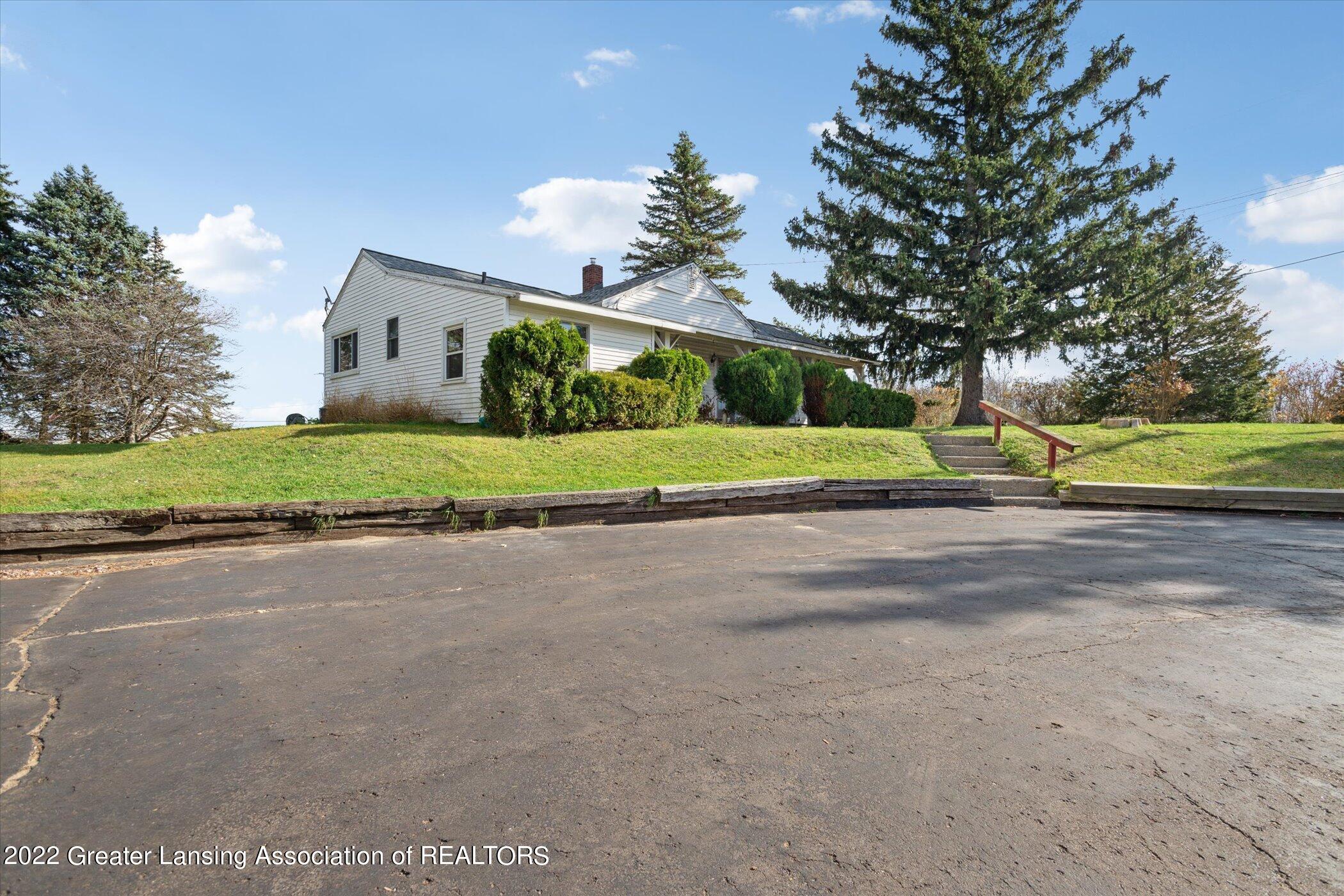 5897 Lansing Road Potterville, MI 48876 - Photo 2 of 34 02-5897-Lansing-Rd-WindowStill-37