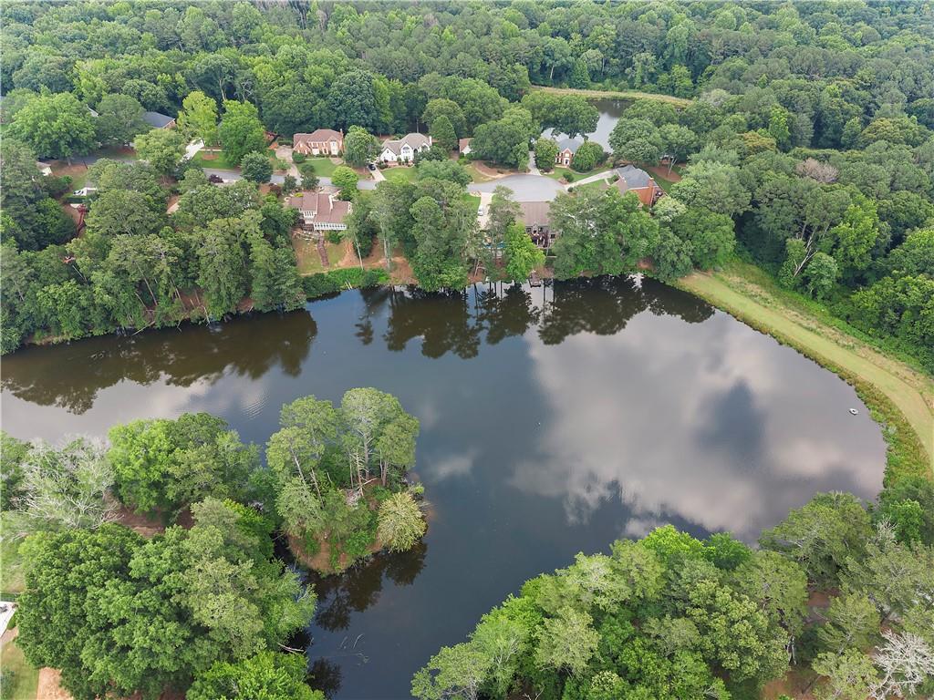8965 Laurel Way Alpharetta, GA 30022 - Photo 62 of 79 an aerial view of a house with a yard and lake view