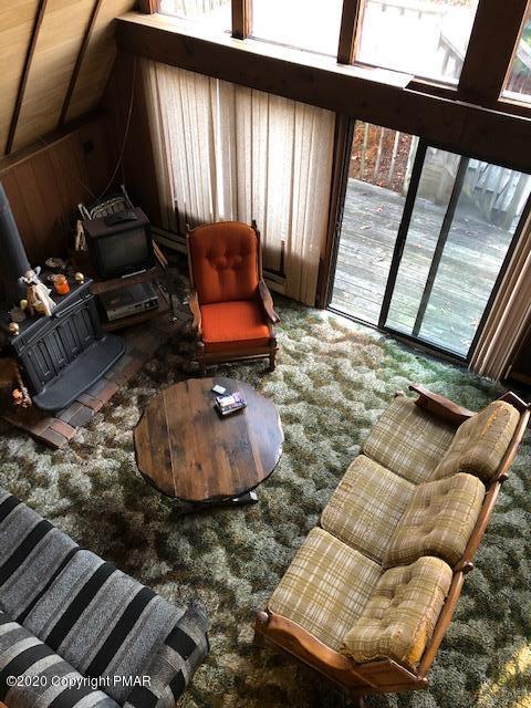 228 Haystack Road Henryville, PA 18332 - Photo 2 of 8 a room with furniture and a window