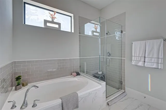 a bathroom with a granite countertop double vanity sink and a mirror