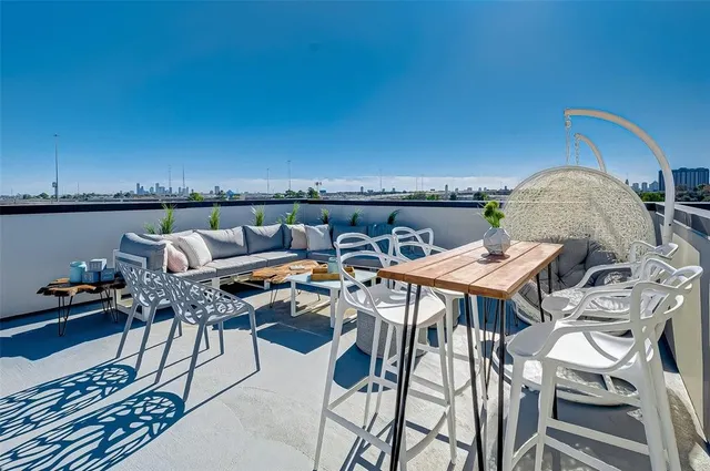 a view of a balcony with furniture