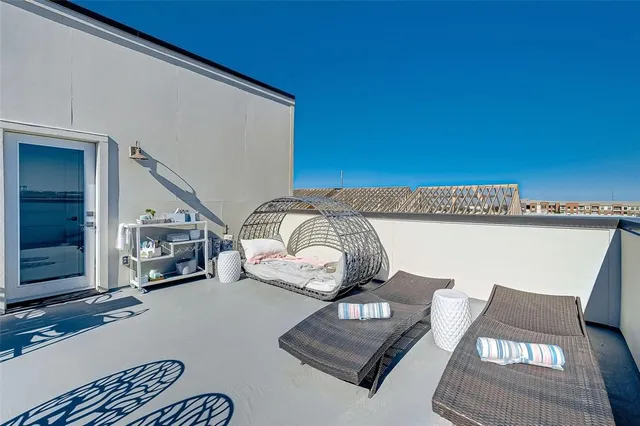 a view of backyard with wooden fence