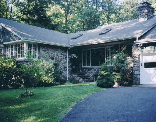 575 Belden Hill Road Norwalk, CT 06850 - Photo 1 of 1 a view of brick house with a yard plants and large tree
