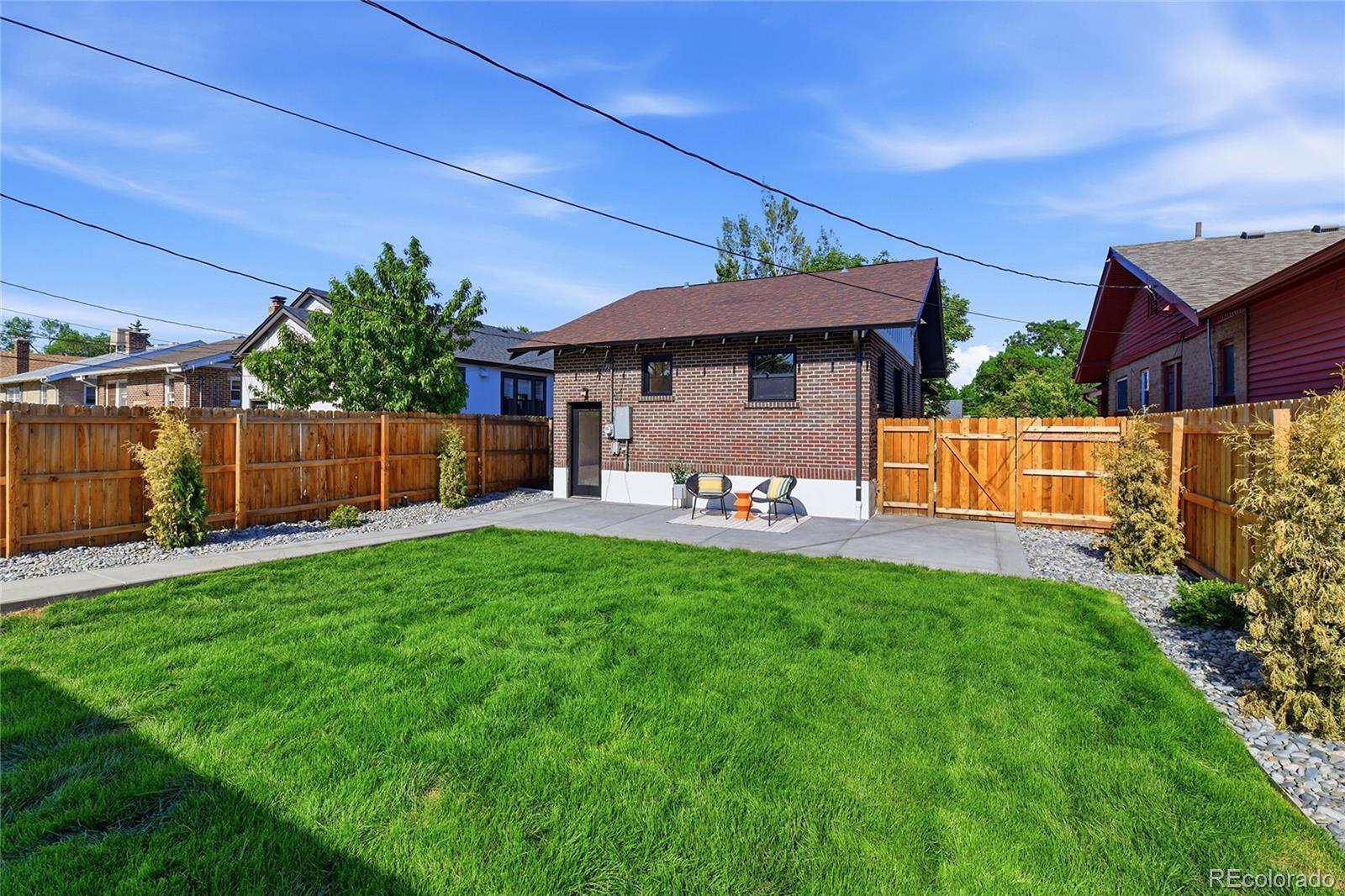 4545 Decatur Street Denver, CO 80211 - Photo 23 of 30 a front view of a house with a yard