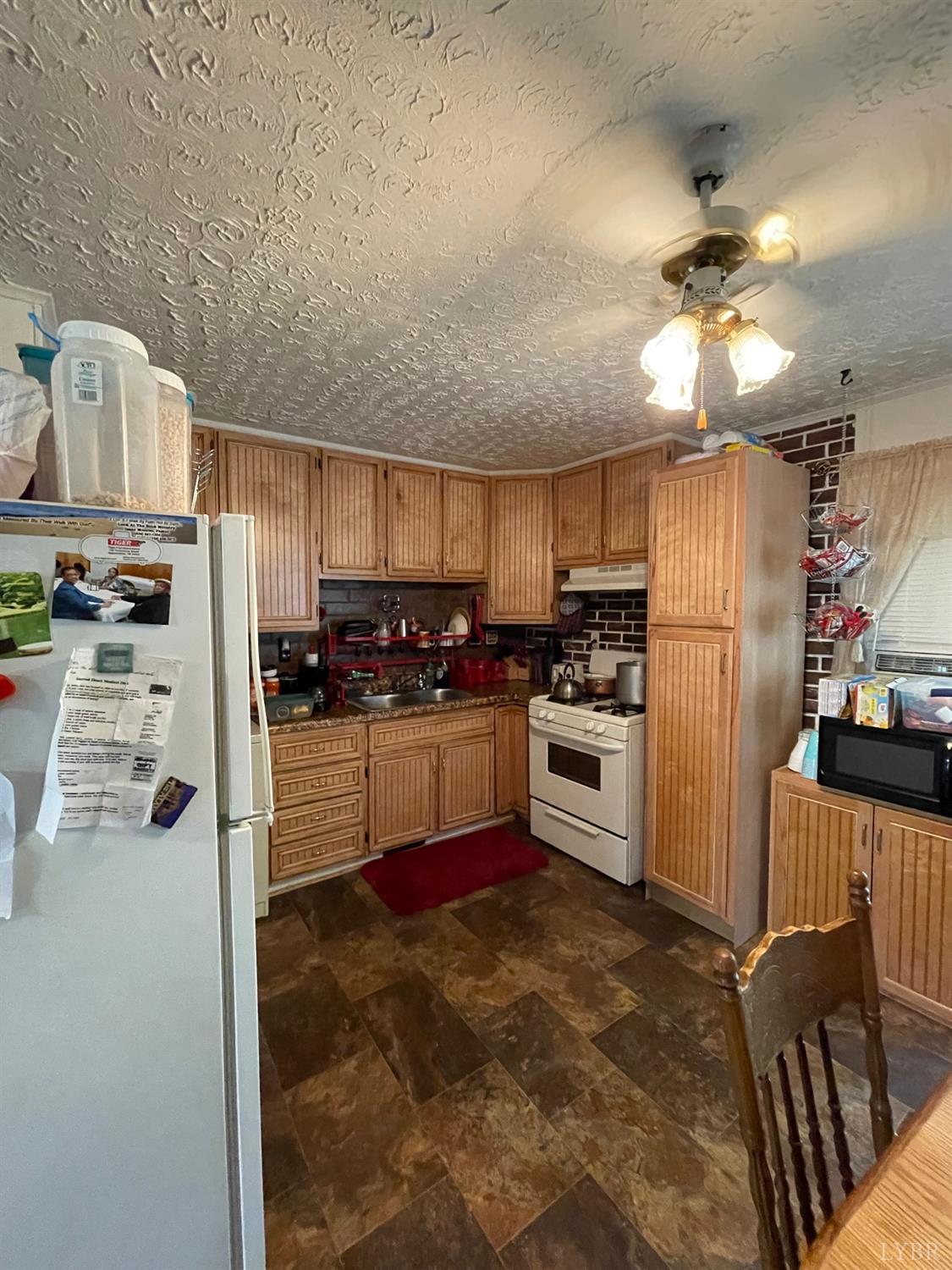 42 Pilot View Road Concord, VA 24538 - Photo 5 of 12 a kitchen with stainless steel appliances a refrigerator sink and stove