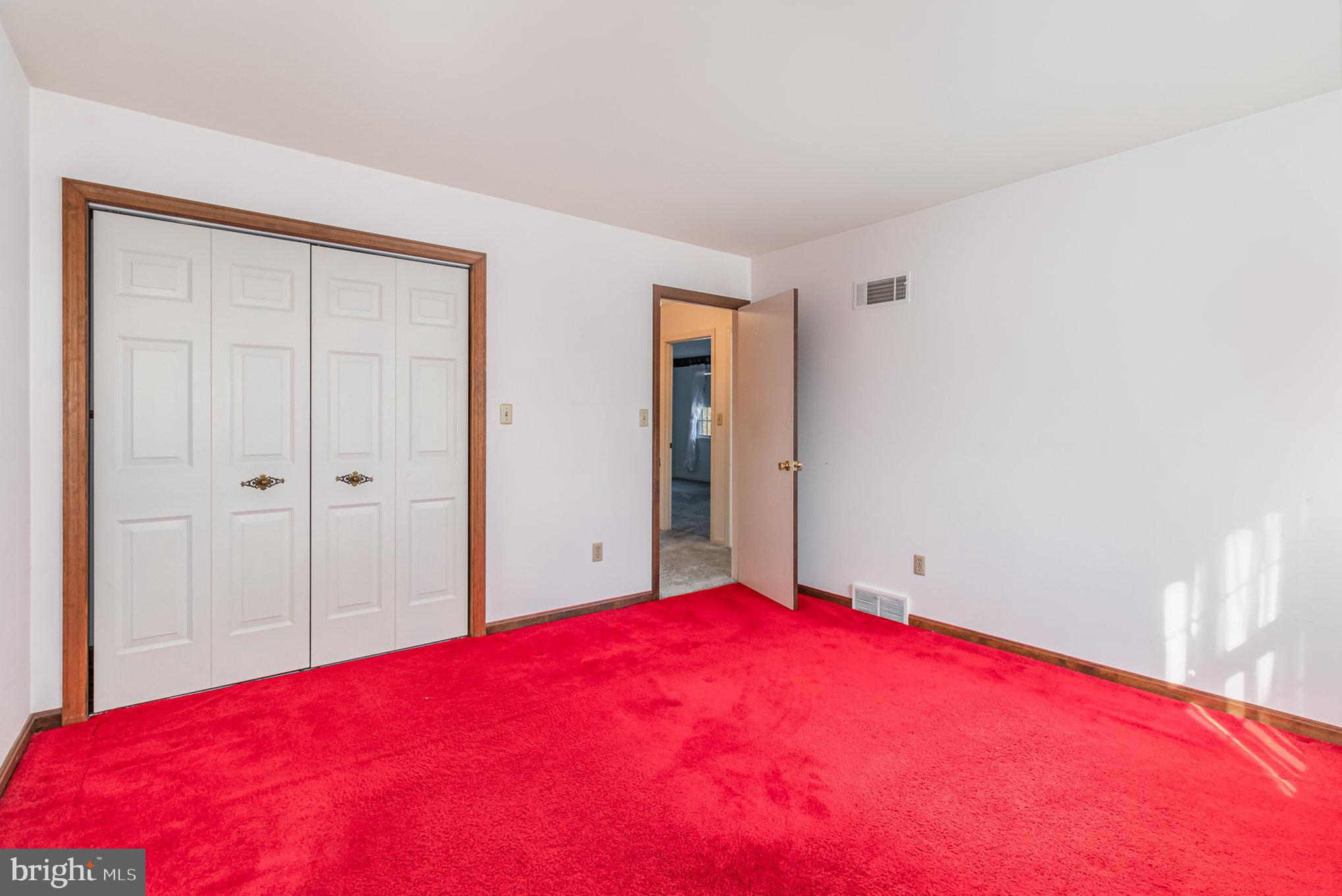 2659 Ritner Highway Carlisle, PA 17015 - Photo 12 of 40 a bed room with a bed and a large mirror