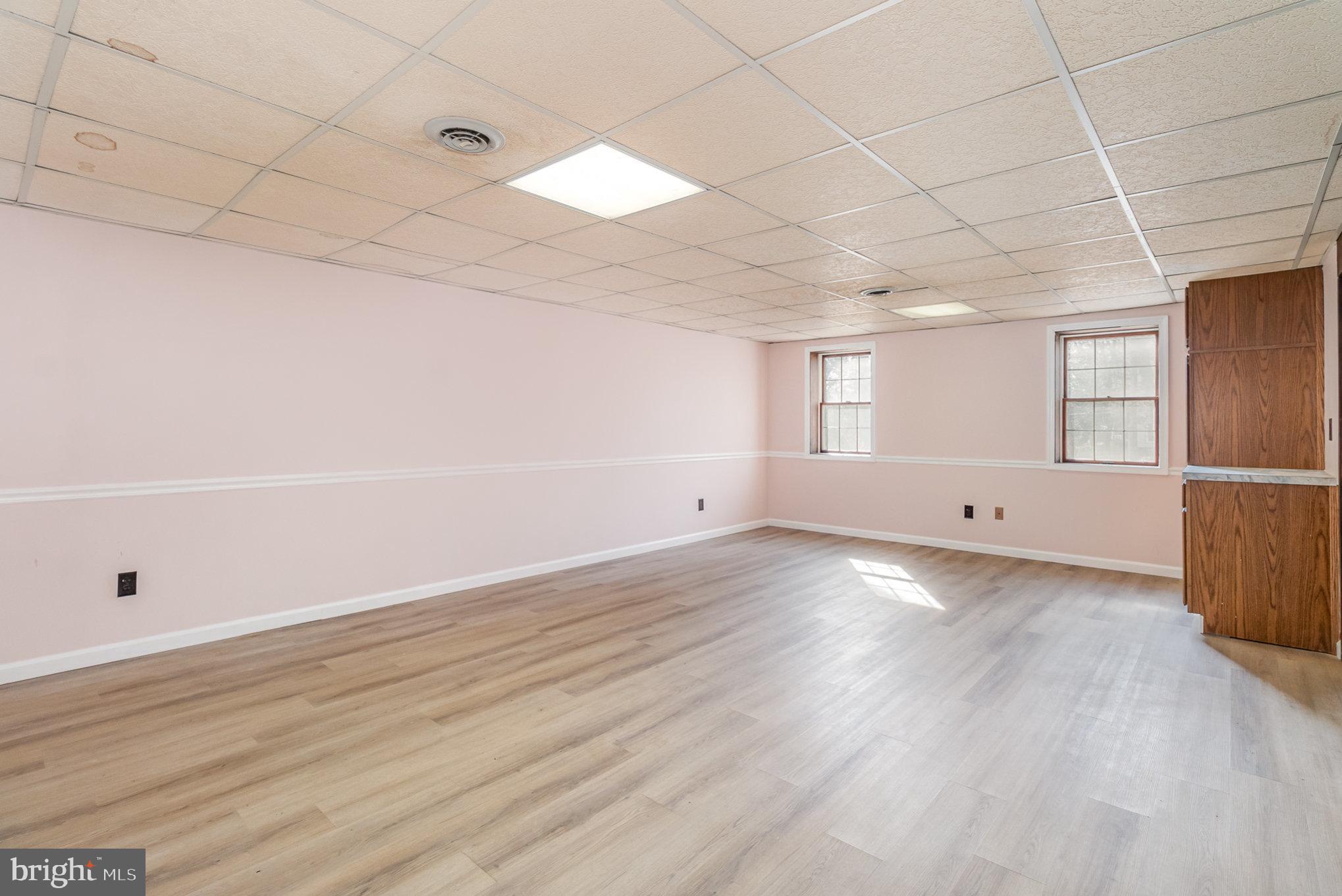 2659 Ritner Highway Carlisle, PA 17015 - Photo 24 of 40 wooden floor in an empty room with a window