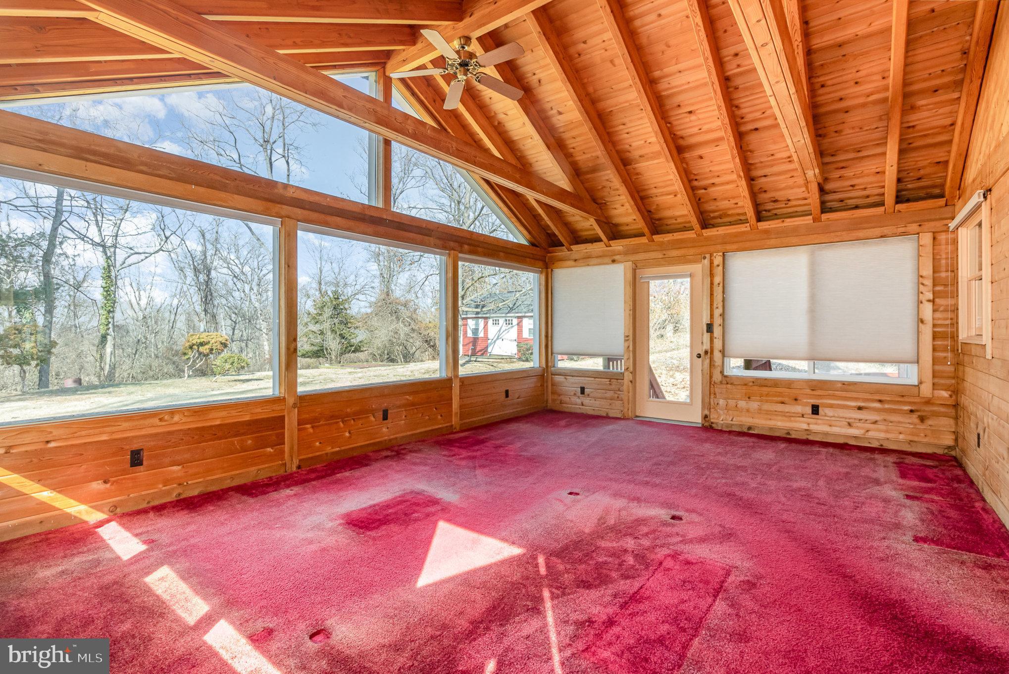 2659 Ritner Highway Carlisle, PA 17015 - Photo 26 of 40 a view of an empty room with a fireplace and a large window