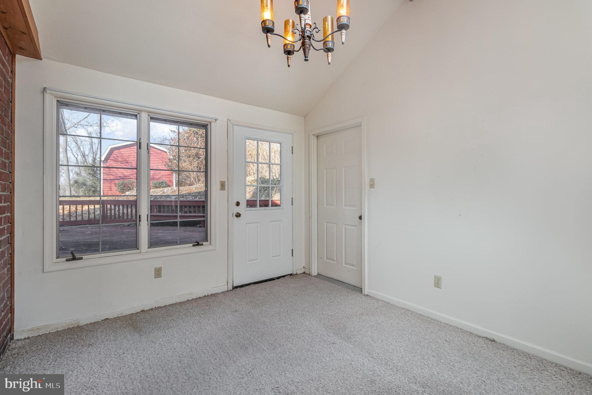 2659 Ritner Highway Carlisle, PA 17015 - Photo 28 of 40 a view of a livingroom with a chandelier fan and window