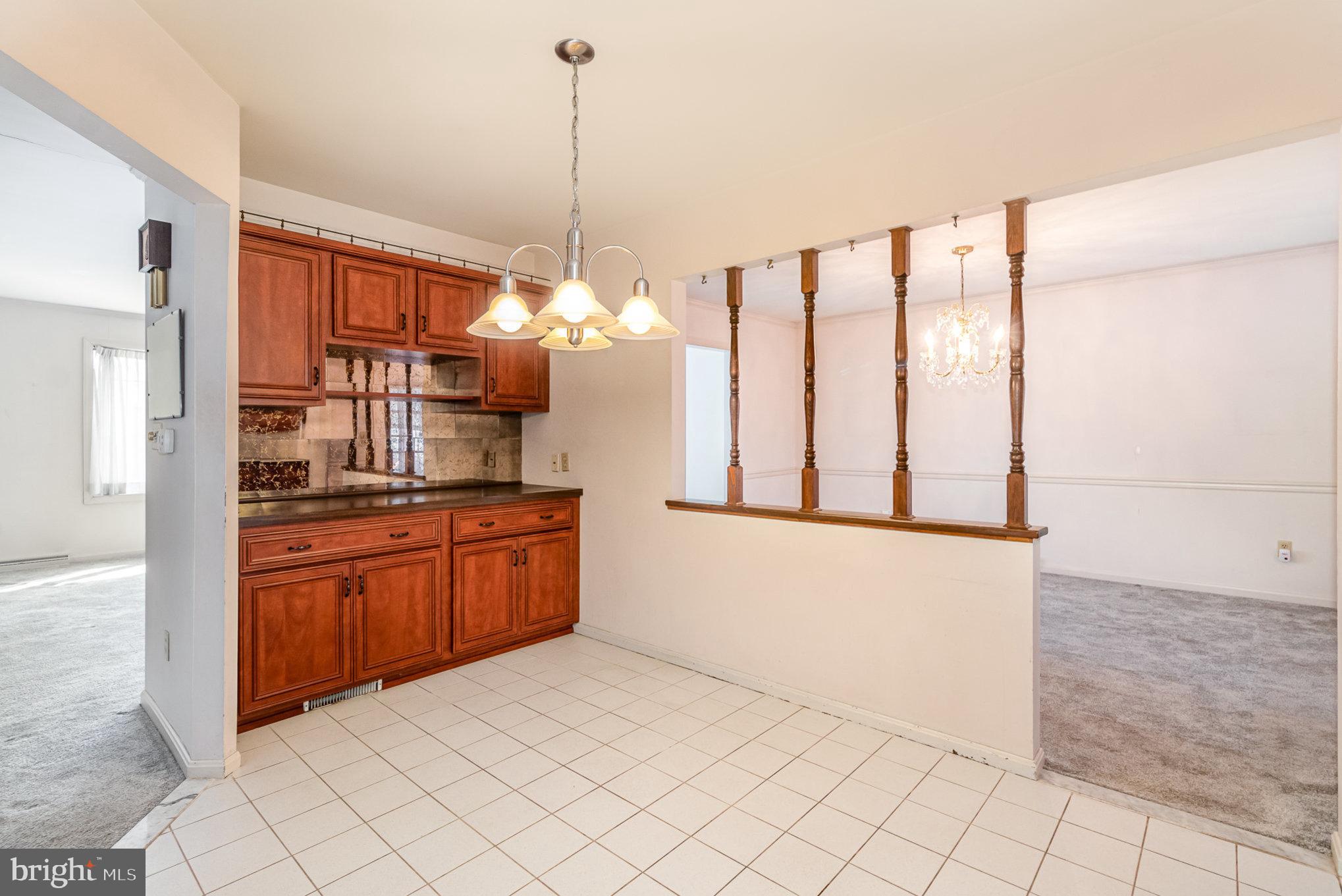 2659 Ritner Highway Carlisle, PA 17015 - Photo 9 of 40 a kitchen with stainless steel appliances granite countertop a stove a sink and a refrigerator
