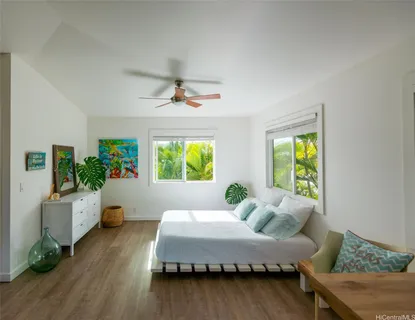 a bed room with a bed and a window
