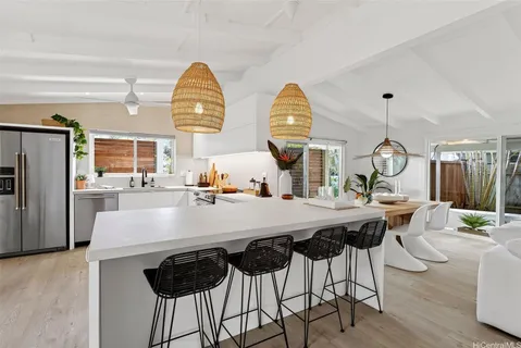 a view of kitchen island dining table and wooden floor