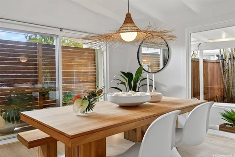 a dining room with table and chairs