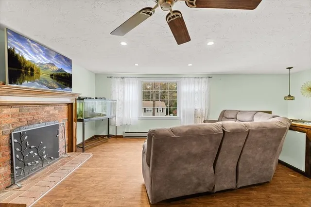 a living room with furniture and a fireplace
