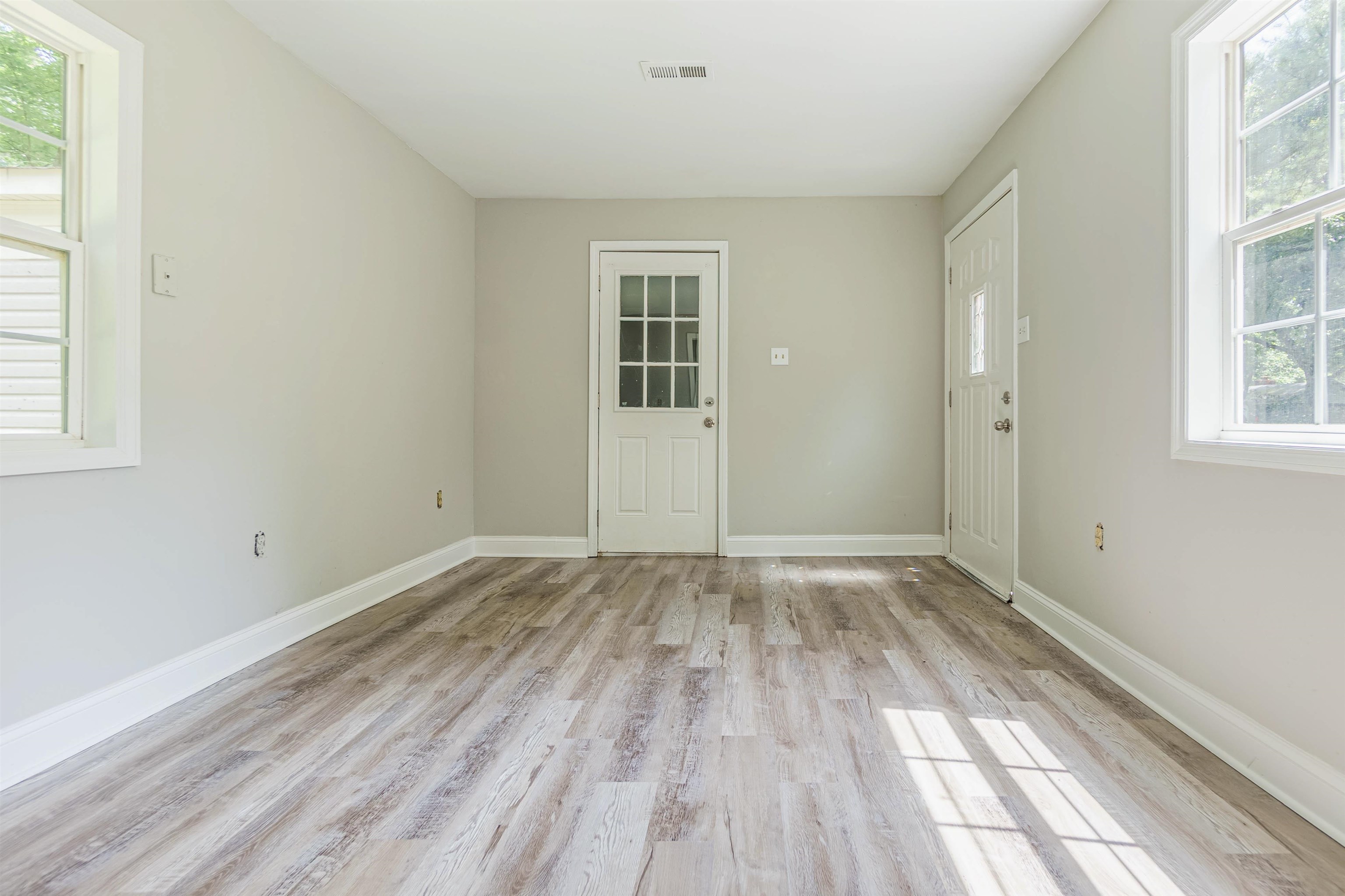 7841 Sherman Road Millington, TN 38053 - Photo 5 of 14 Spare room with a healthy amount of sunlight and light wood-type flooring