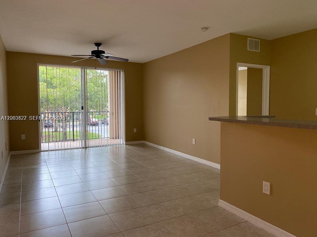 8060 North Nob Hill Road, Unit 203 Tamarac, FL 33321 - Photo 15 of 69 a view of an empty room with a window