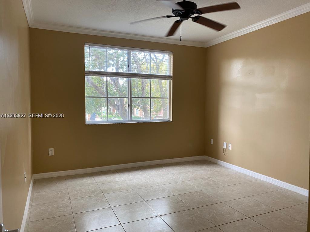 8060 North Nob Hill Road, Unit 203 Tamarac, FL 33321 - Photo 17 of 69 a view of an empty room with a window