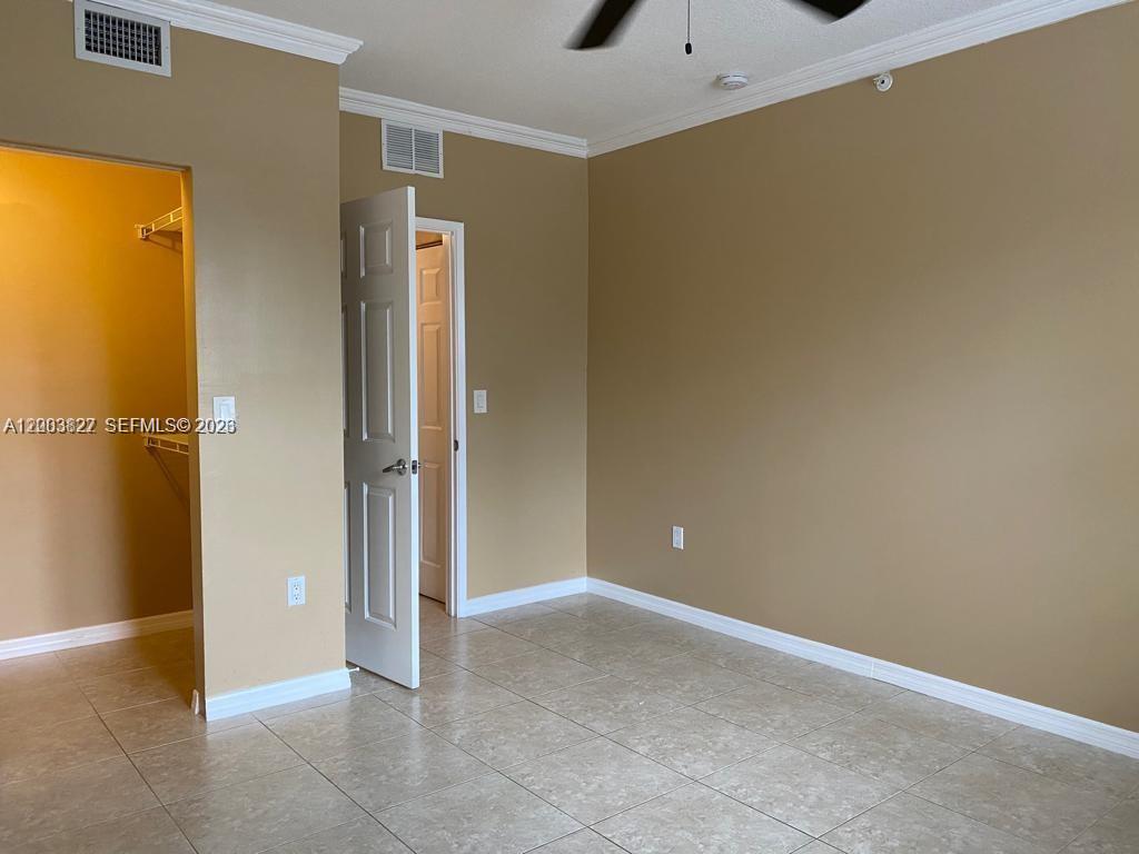 8060 North Nob Hill Road, Unit 203 Tamarac, FL 33321 - Photo 18 of 69 a view of an empty room with wooden floor