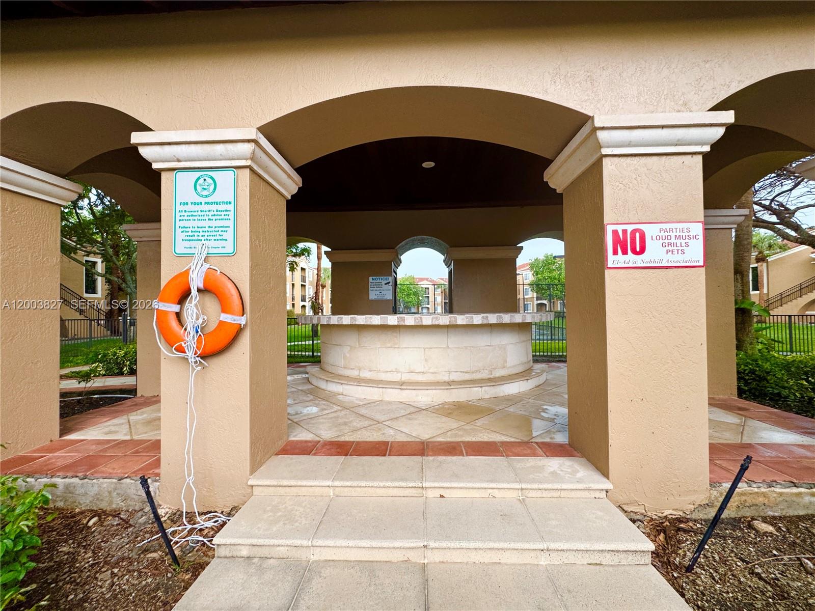 8060 North Nob Hill Road, Unit 203 Tamarac, FL 33321 - Photo 28 of 69 a front view of a house with entryway
