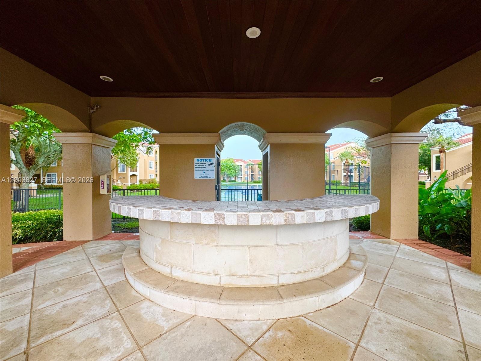 8060 North Nob Hill Road, Unit 203 Tamarac, FL 33321 - Photo 29 of 69 a view of multi story residential apartment building with a yard