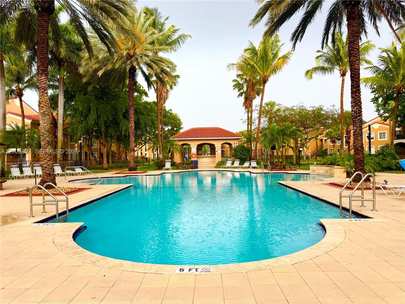 8060 North Nob Hill Road, Unit 203 Tamarac, FL 33321 - Photo 36 of 69 a view of a swimming pool with a patio