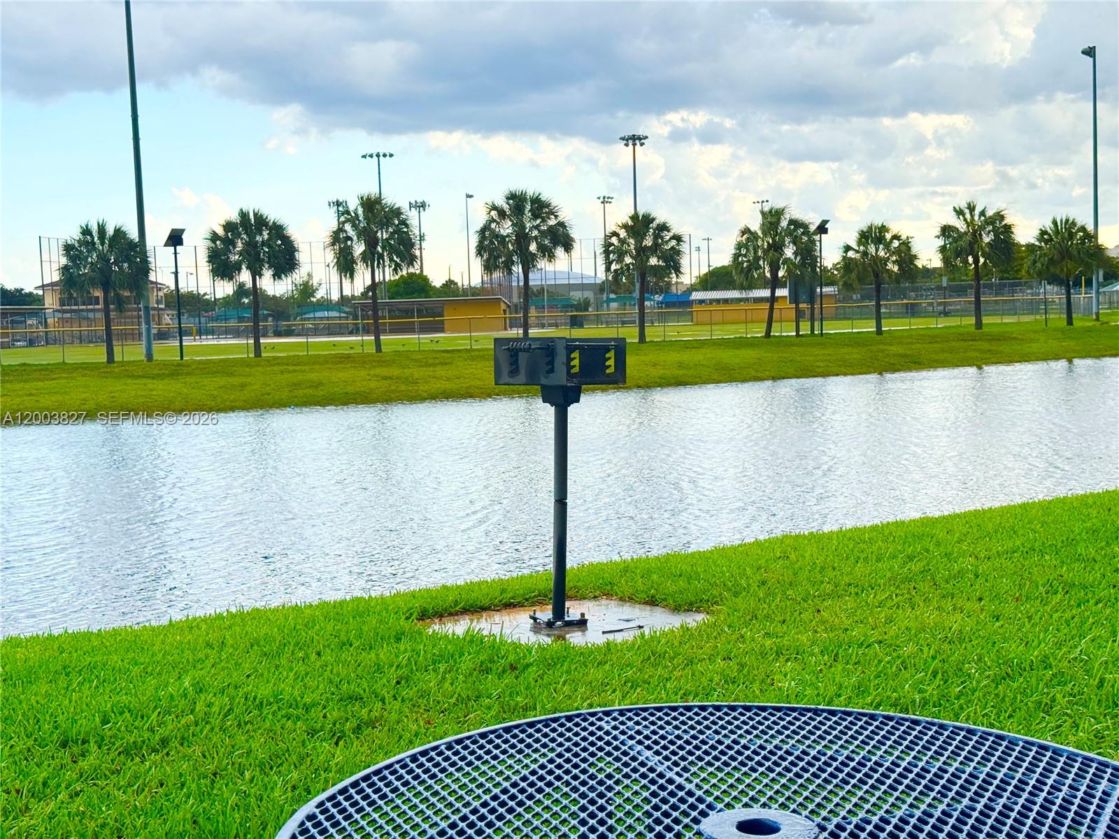 8060 North Nob Hill Road, Unit 203 Tamarac, FL 33321 - Photo 62 of 69 a view of a park with a large trees