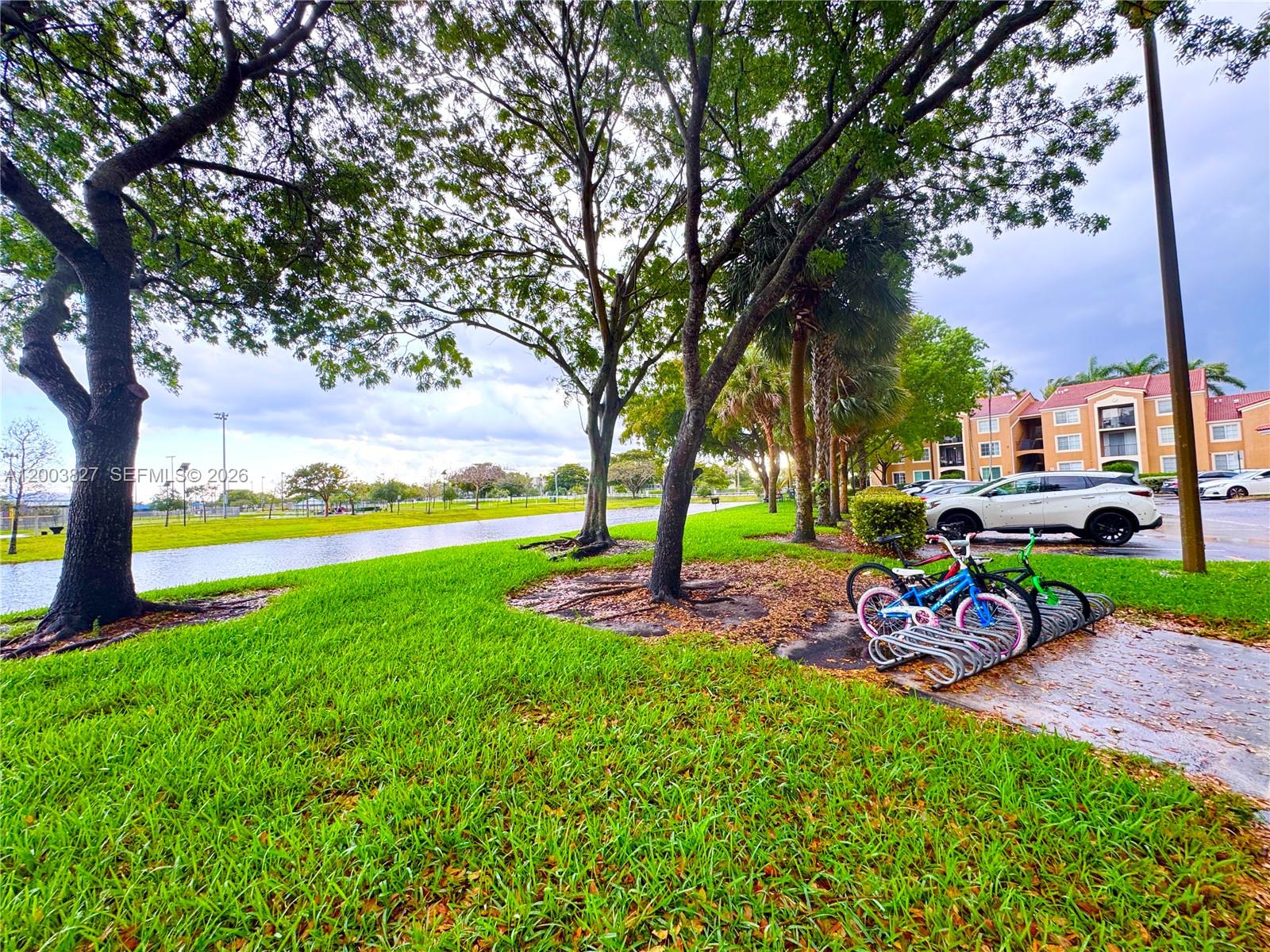 8060 North Nob Hill Road, Unit 203 Tamarac, FL 33321 - Photo 67 of 69 a view of a park with large trees