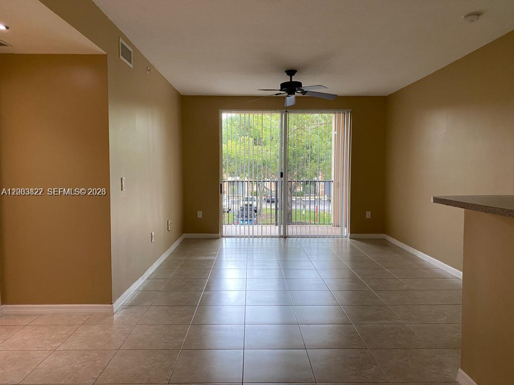 8060 North Nob Hill Road, Unit 203 Tamarac, FL 33321 - Photo 9 of 69 a view of an empty room with a window