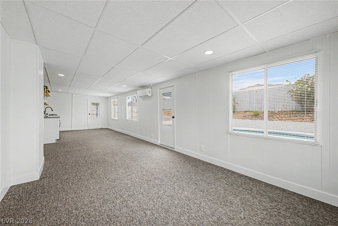 324 Lakehurst Road Las Vegas, NV 89145 - Photo 17 of 30 An open and versatile lower level offers clean finishes with textured flooring and abundant natural light.