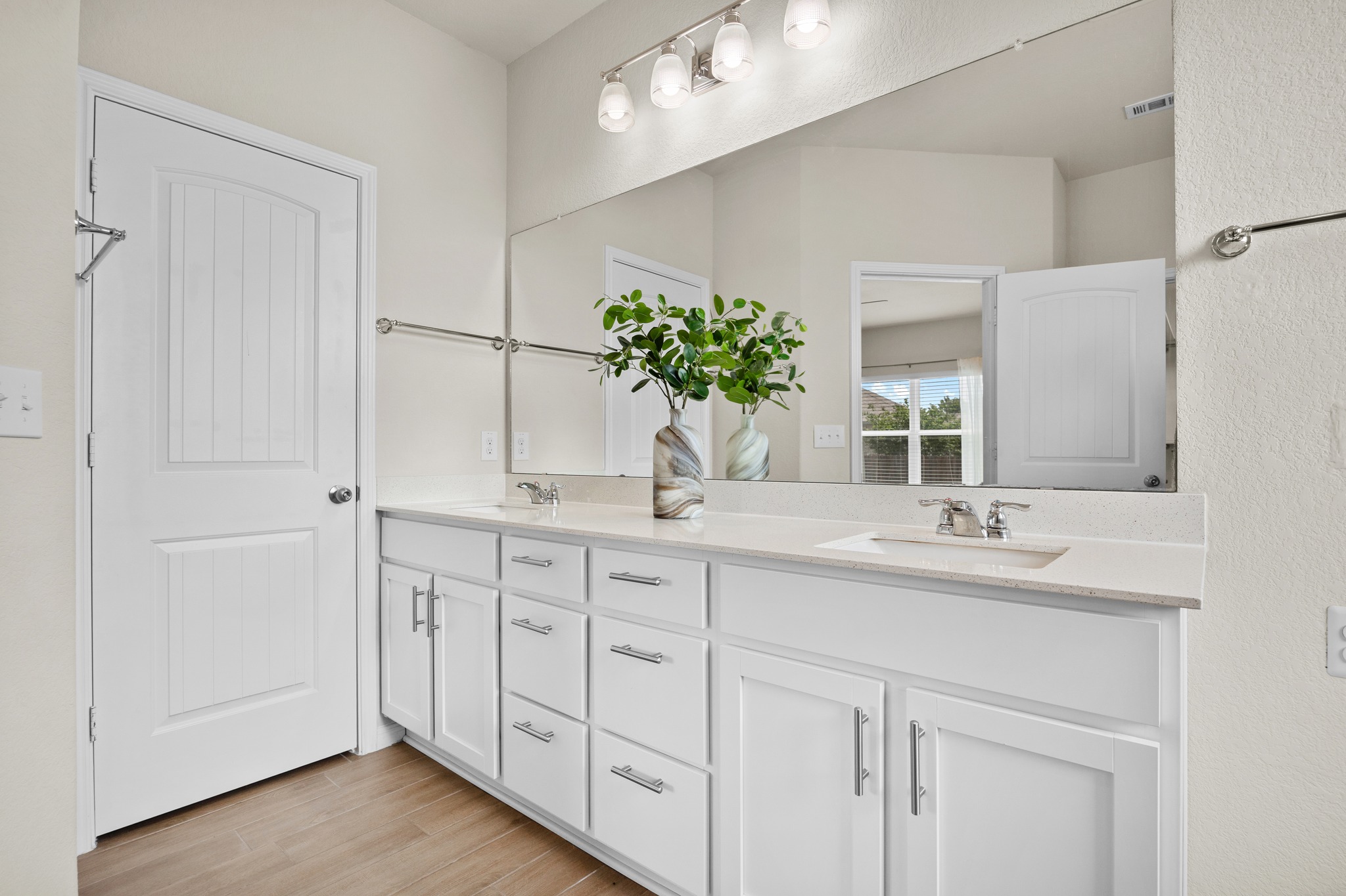 2413 Starhill Ranch Street Georgetown, TX 78628 - Photo 20 of 40 a bathroom with a double vanity sink and a mirror